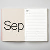 Open planner showing September layout on a gray background. 2026 Planner | Kinshipped | Shop Fodder