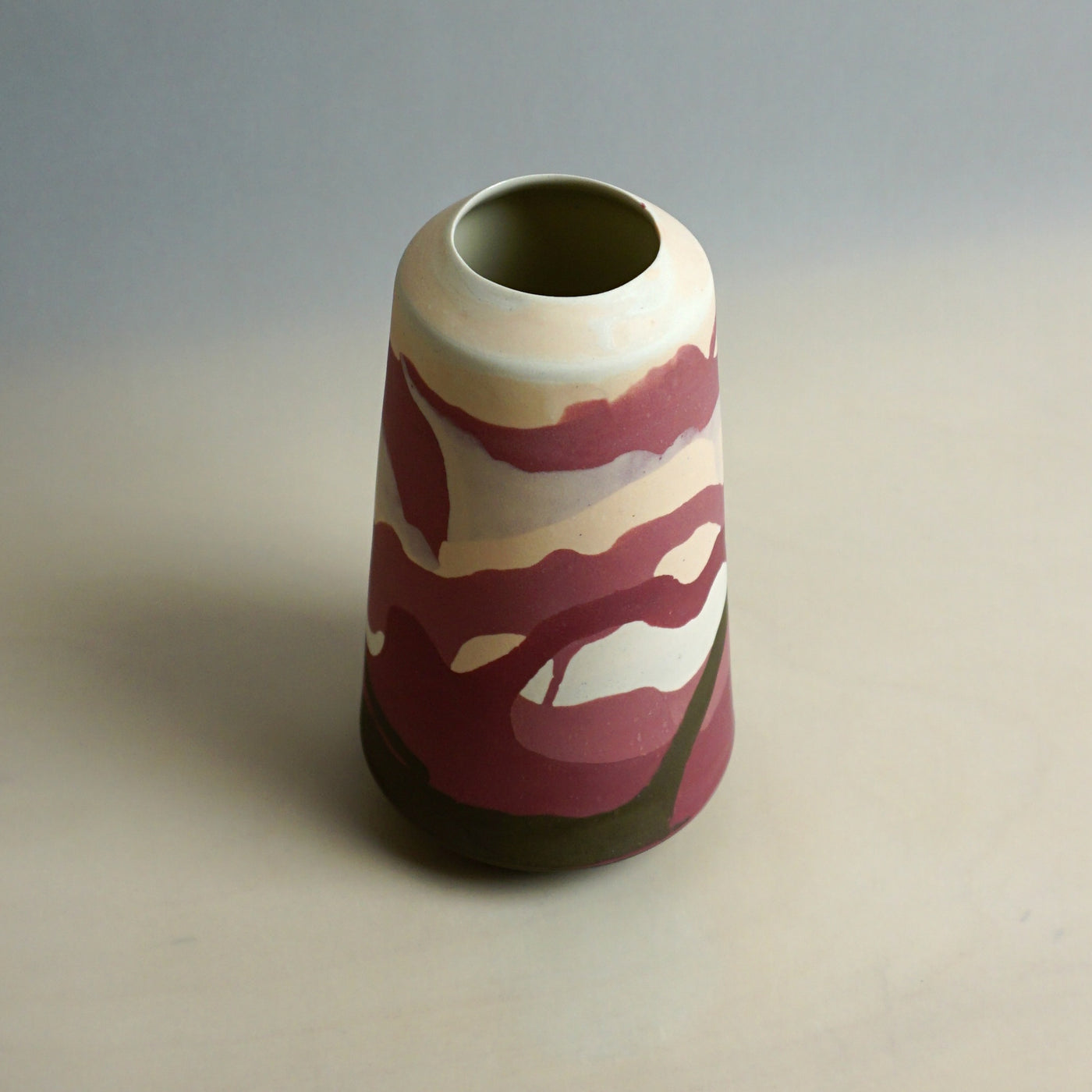 Cylindrical ceramic vase with a pattern on a neutral background. Dreamlands Vase | Anna Jones Ceramics | Shop Fodder