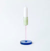 coloured glass candlestick holder on white background