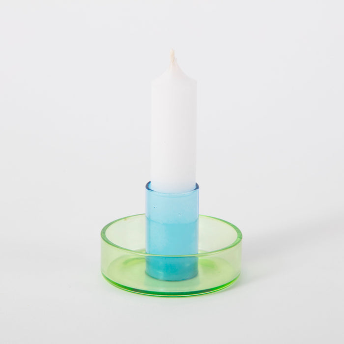 green and blue candlestick holder on white background. 
