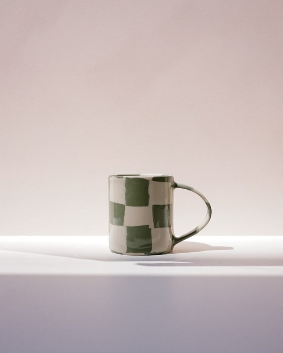 Checkered mug on a gradient background. Fern Taylor Nerikomi Ceramics. Fodder