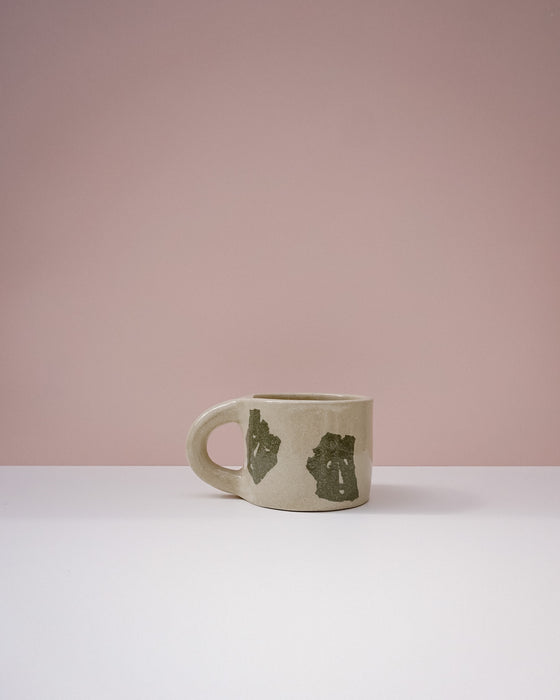 Green ceramic mug with bear designs on a pink background. Portrait Mug | Brutes London | Handmade Ceramics | Fodder
