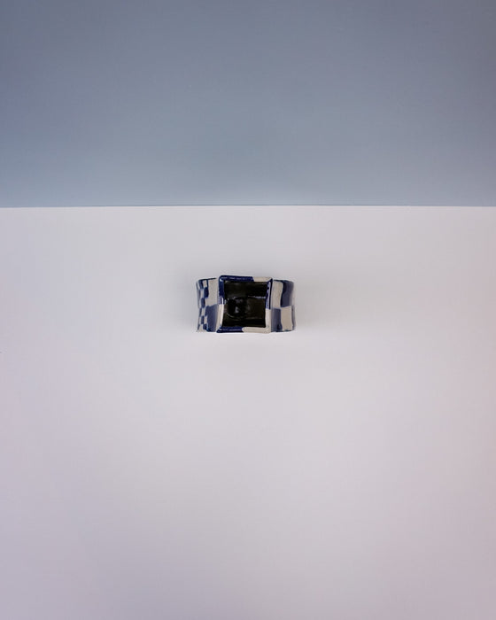 Blue and black patterned ring on a white background. Nerikomi Vase | Fern Taylor | Shop Fodder