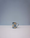 Checkered ceramic mug on a light gray background. Checkerboard Nerikomi Ceramic Mug | Fern Taylor | Kentish Town Stores