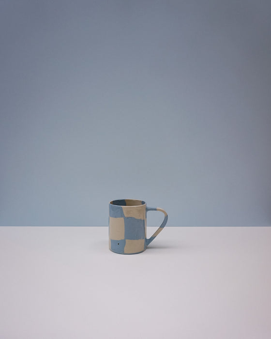 Checkered ceramic mug on a light gray background. Checkerboard Nerikomi Ceramic Mug | Fern Taylor | Kentish Town Stores