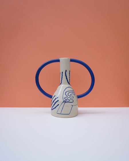 Ceramic vase with blue handles and abstract design on a peach background. Sophie Alda | Handmade Ceramics | Shop Fodder