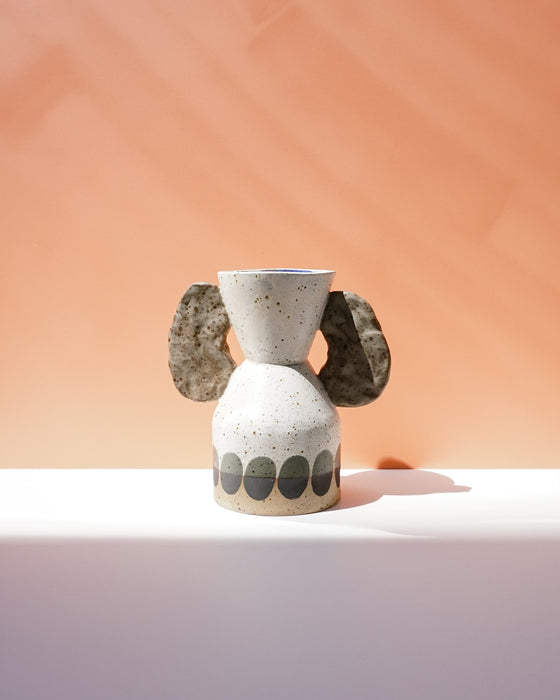 Ceramic vase with dog ears on a peach background. Sophie Alda | Handmade Ceramics | Shop Fodder