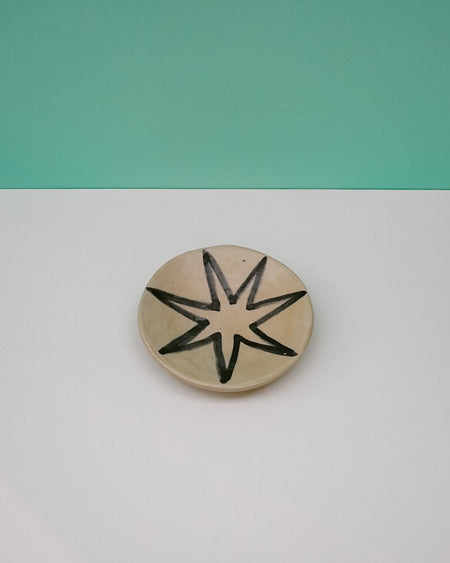 Ceramic disc with star design on a two-tone background. Diddy Bowl | Jode Pankhurst | Shop Fodder