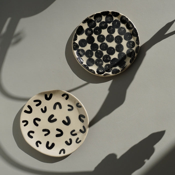 two flat handmade ceramic dishes on a table in the sunshine. . Trinket Dish | Jode Pankhurst | Shop Fodder
