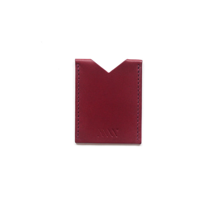 a wine red leather card holder on a white background. 