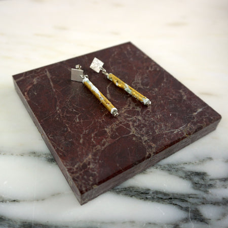 Pair of earrings on a marbled surface | Scarlett Cohen French | Shop Fodder