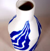 the neck of a porcelain white bottle vase with a bright blue leaf pattern. Sophie Alda | Handmade Ceramics | Shop Fodder